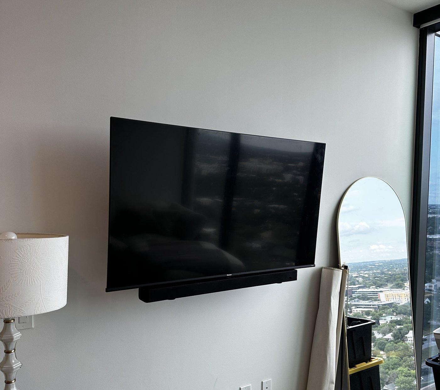 Hisense TV with a soundbar mounted below it